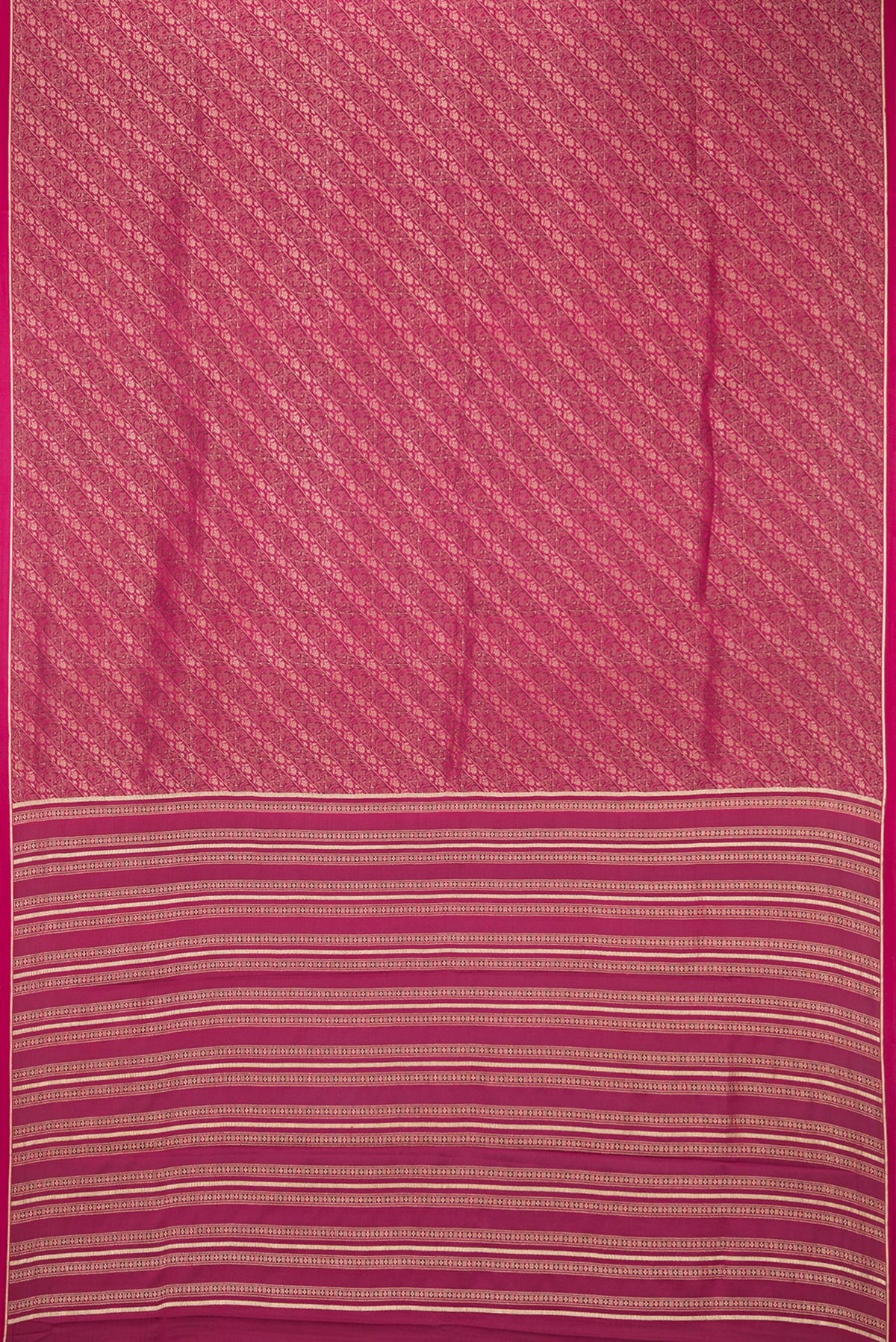 Flat view of Magenta Georgette Saree with Zari Brocade on the body and Zari Border. 
