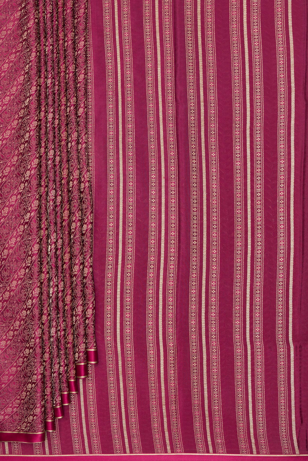 Pleats and pallu of Magenta Georgette Saree with Zari Brocade on the body and Zari Border. 