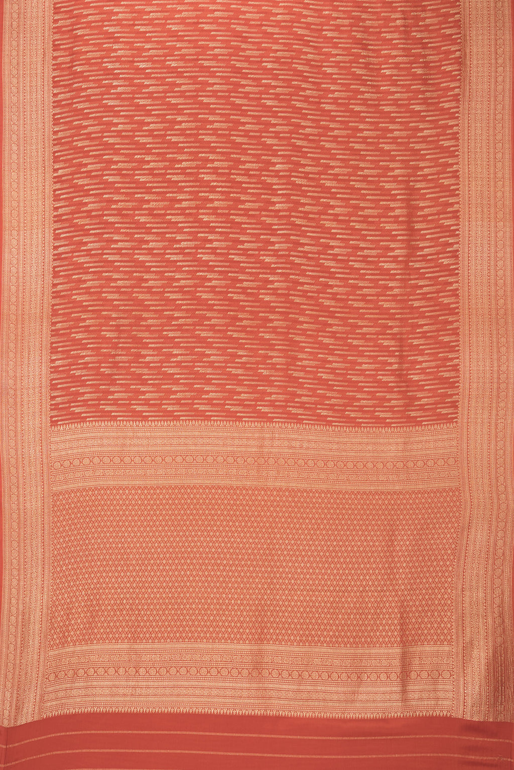 Flat view of Rust Dual Tone Banarasi Georgette Saree with Zari Brocade on the body and Zari Border. 