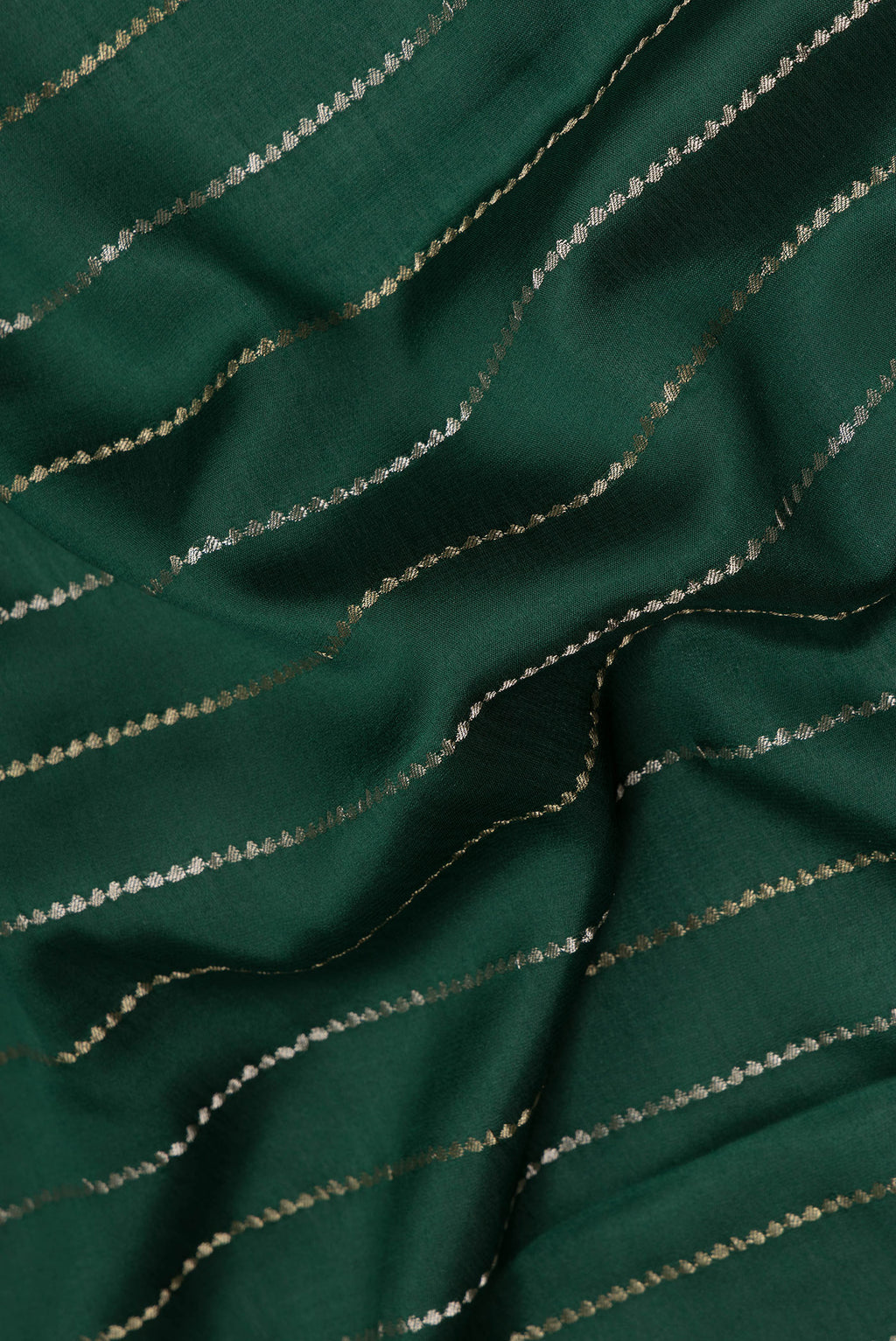 Close up of Pure Silk Bottle Green Dual Tone Banarasi Georgette Saree with Stripes on the body and Zari Border.  displaying folds