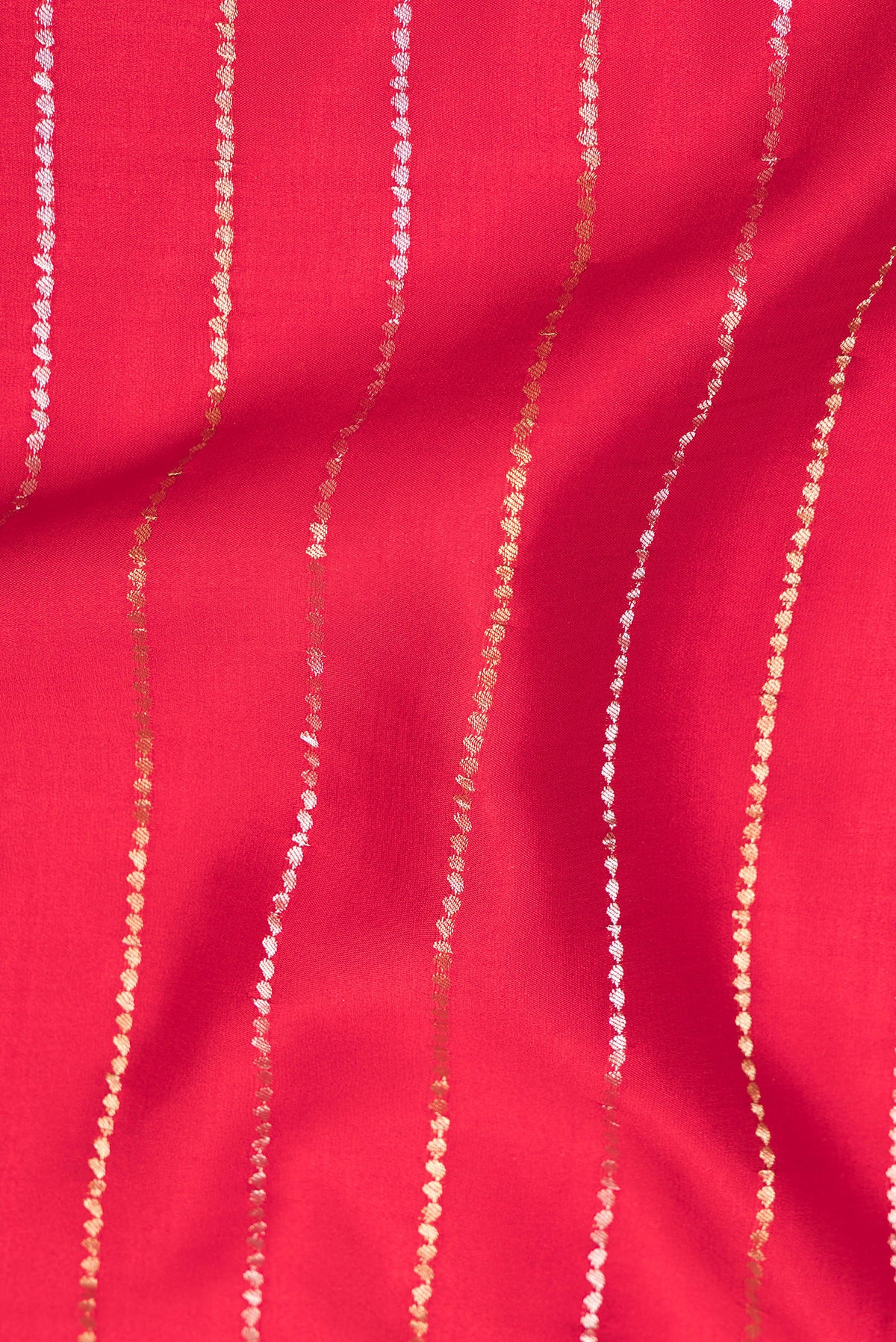 Close up of Red Mysore Crepe Saree with Stripes on the body and Plain Border.  displaying folds