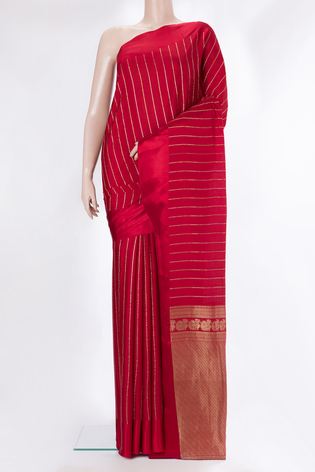 Red Mysore Crepe Saree with Stripes on the body and Plain Border.  displayed on a mannequin