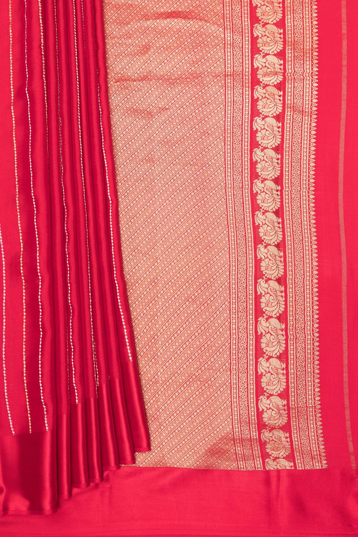 Pleats and pallu of Red Mysore Crepe Saree with Stripes on the body and Plain Border. 