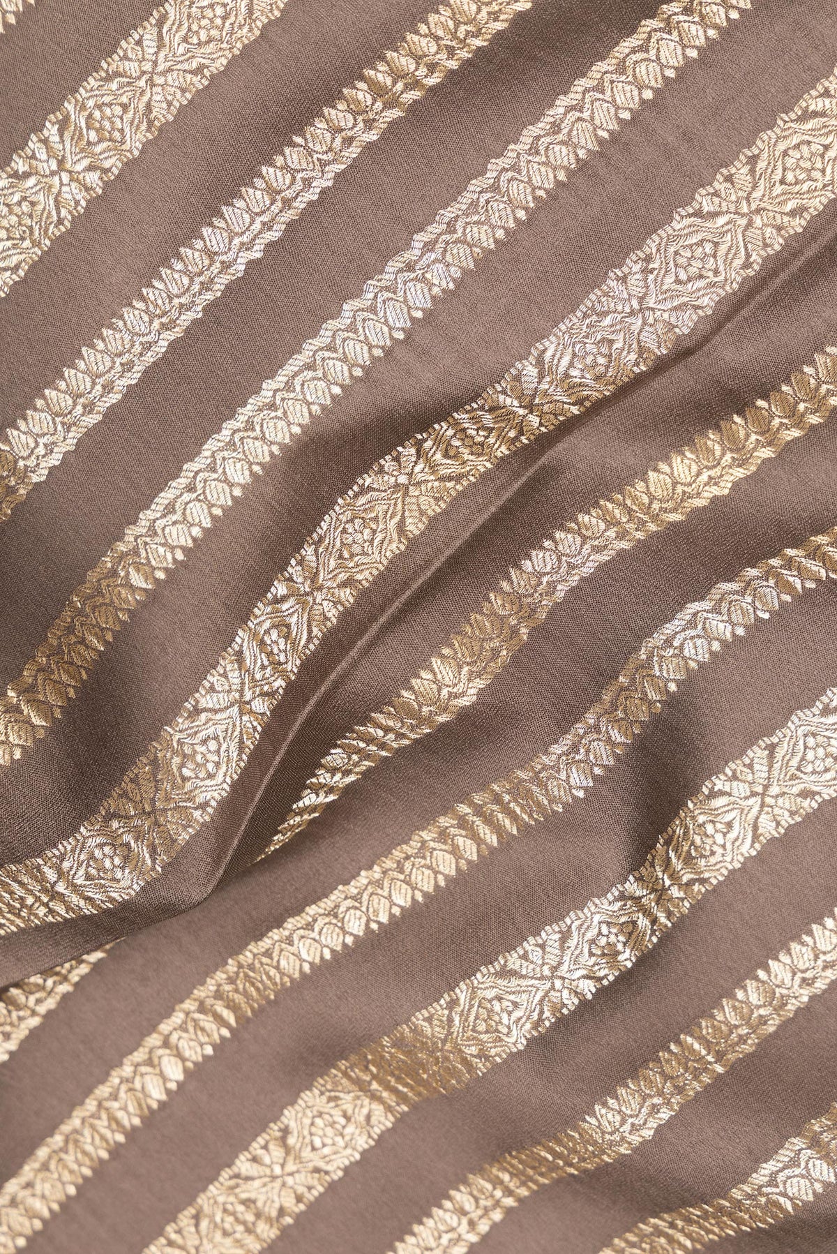 Close up of Dark Beige Mysore Crepe Saree with Stripes on the body and Zari Border.  displaying folds