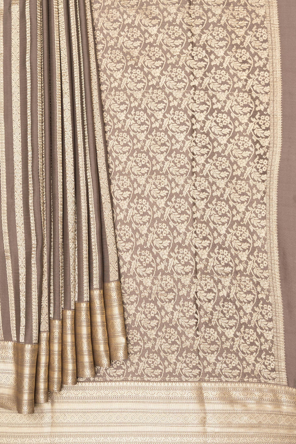 Pleats and pallu of Dark Beige Mysore Crepe Saree with Stripes on the body and Zari Border. 