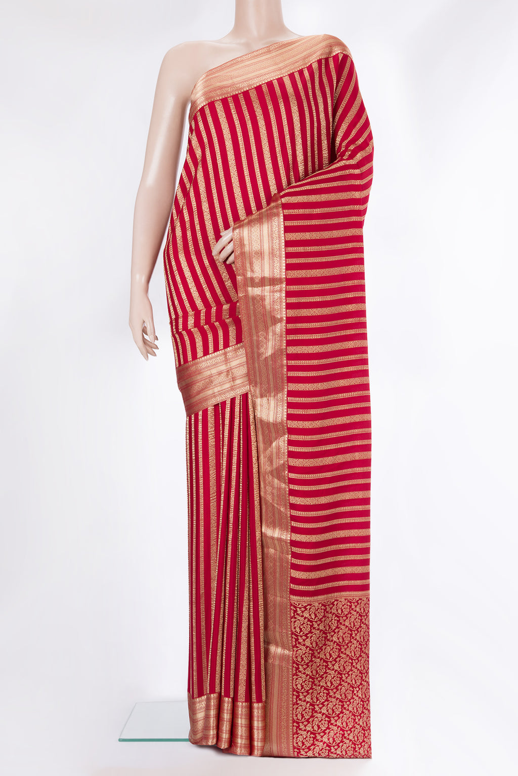 Red Mysore Crepe Saree with Stripes on the body and Zari Border.  displayed on a mannequin