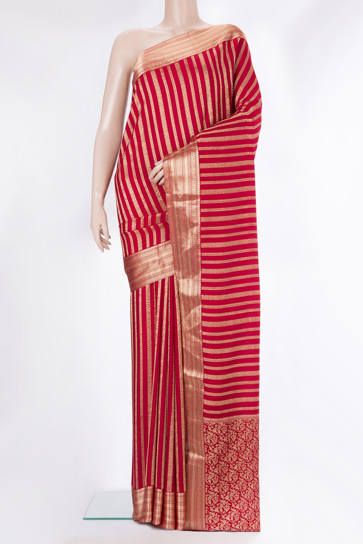 Red Mysore Crepe Saree with Stripes on the body and Zari Border.  displayed on a mannequin