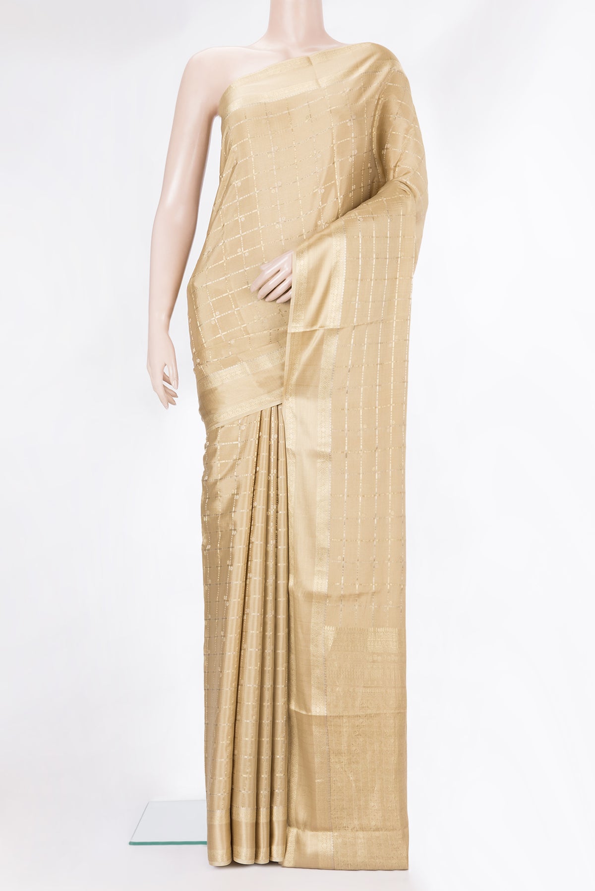 Beige Dual Tone Banarasi Georgette Saree with Checked design on the body and Zari Border.  displayed on a mannequin