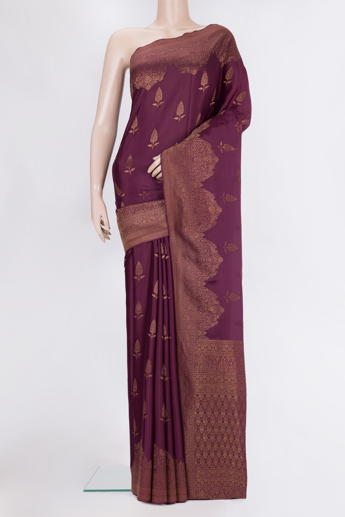 Magenta Georgette Saree with Zari Brocade on the body and Zari Border.  displayed on a mannequin