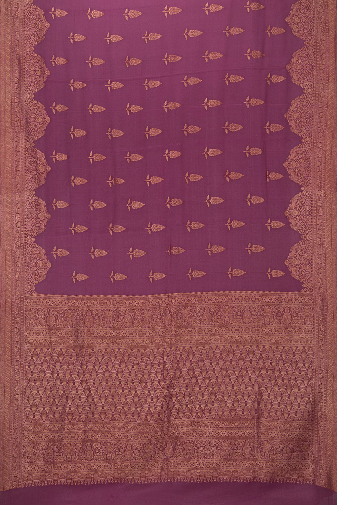 Flat view of Magenta Georgette Saree with Zari Brocade on the body and Zari Border. 