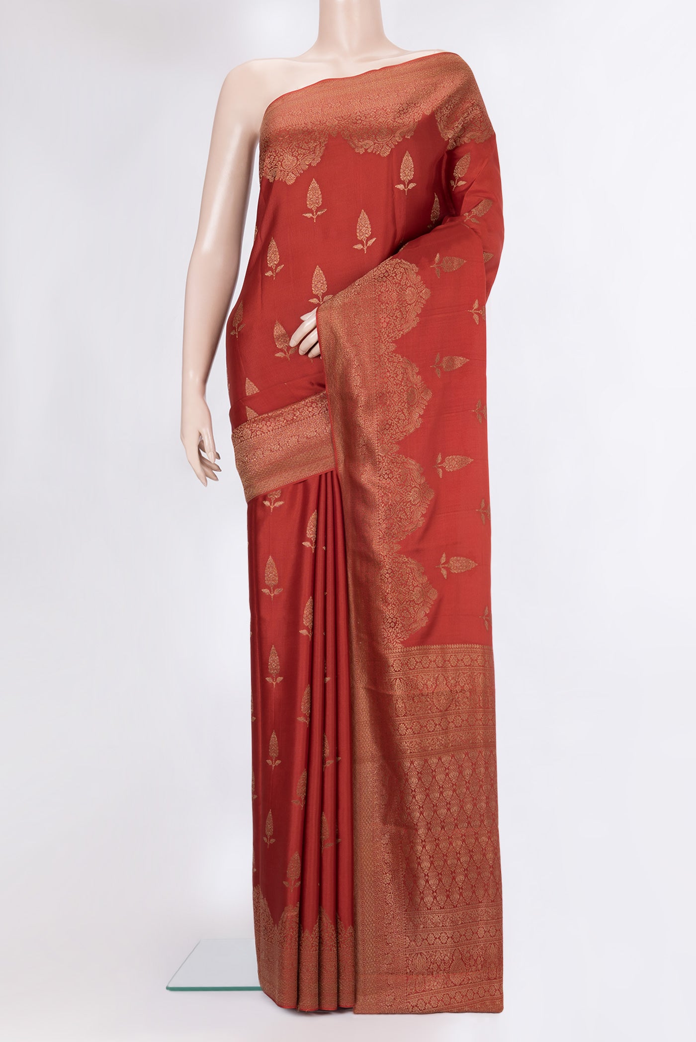 Rust Dual Tone Banarasi Georgette Saree with Zari Butta on the body and Fancy Border.  displayed on a mannequin