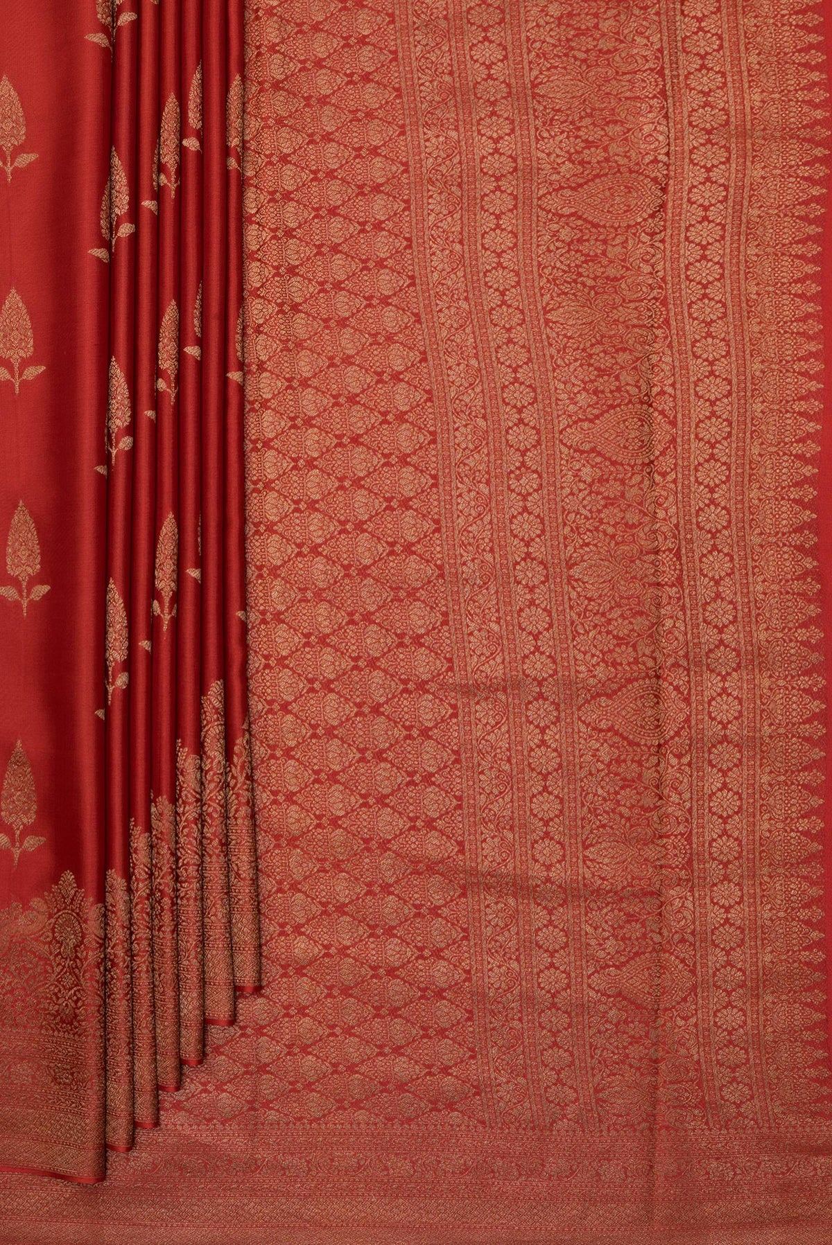 Pleats and pallu of Rust Dual Tone Banarasi Georgette Saree with Zari Butta on the body and Fancy Border. 