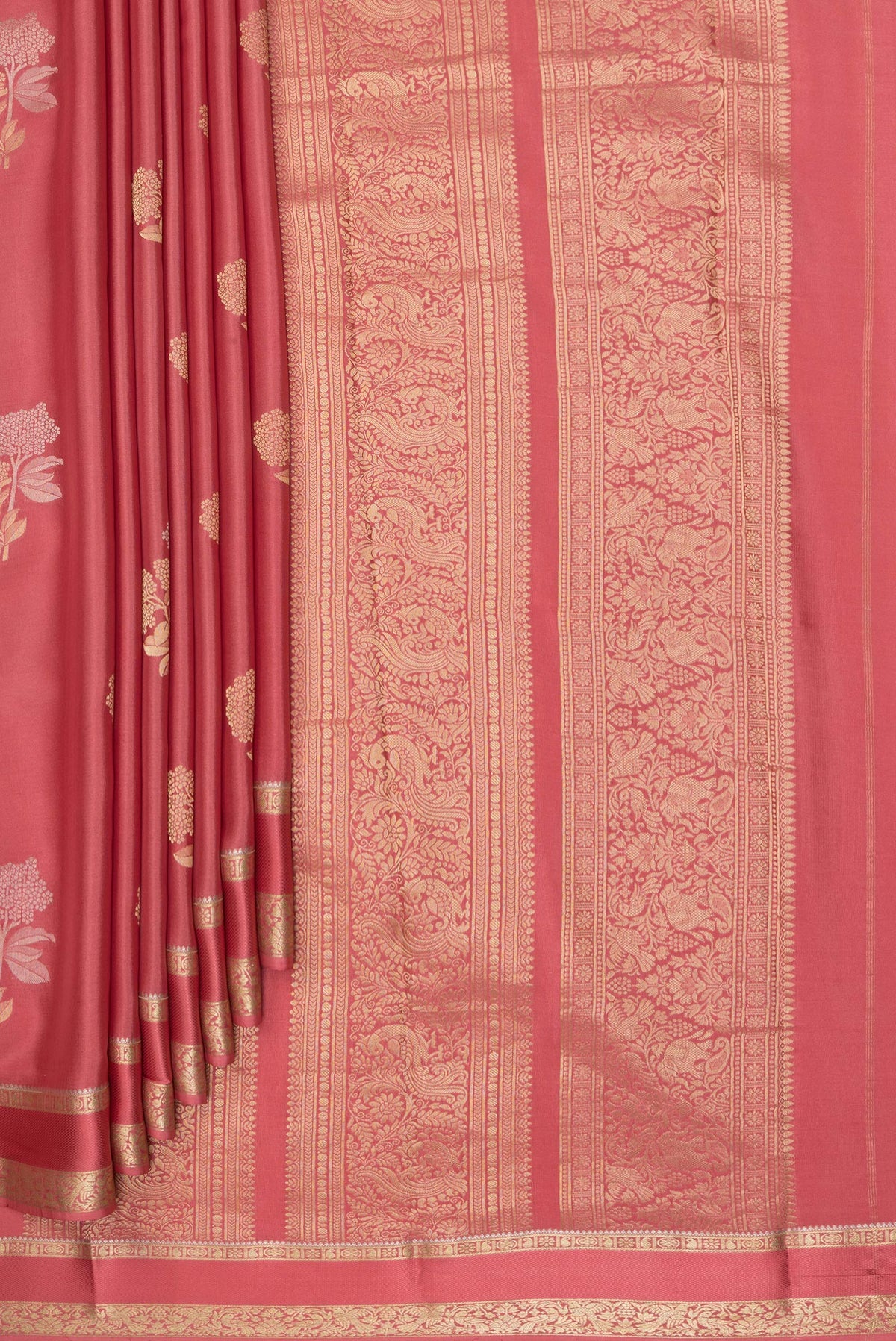 Pleats and pallu of Pink Georgette Saree with Zari Brocade on the body and Zari Border. 