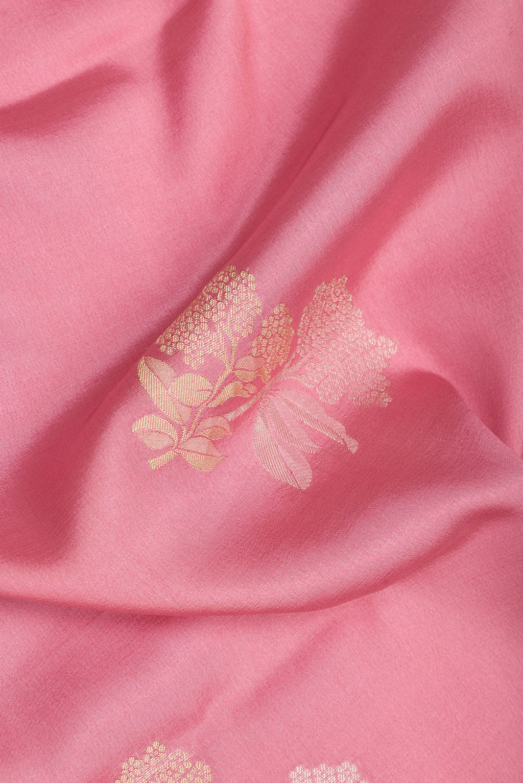 Close up of Pink Dual Tone Banarasi Georgette Saree with Zari Butta on the body and Zari And Thread Border.  displaying folds