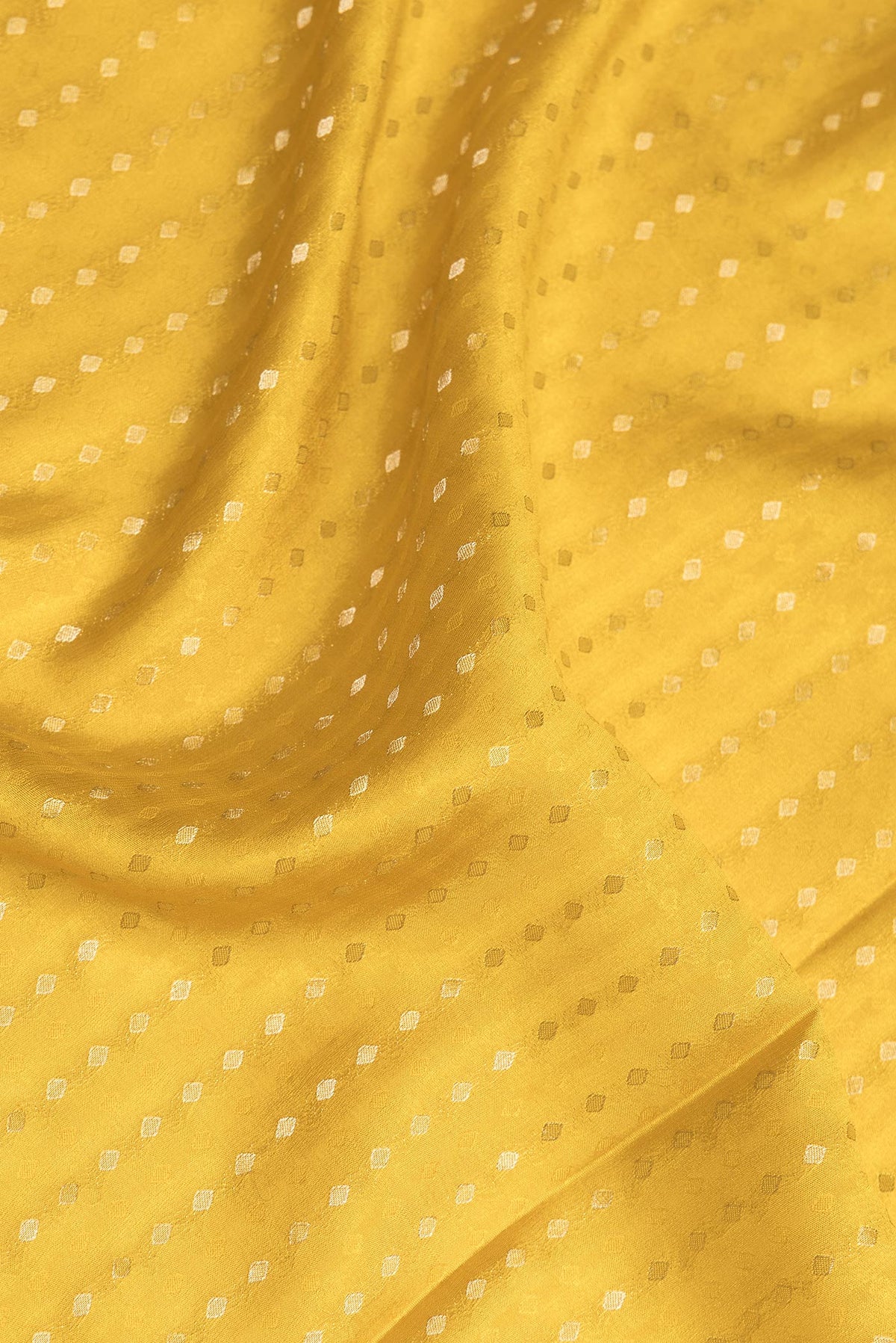 Close up of Pure Silk Mustard Dual Tone Banarasi Georgette Saree with Zari Butta on the body and Without Border.  displaying folds