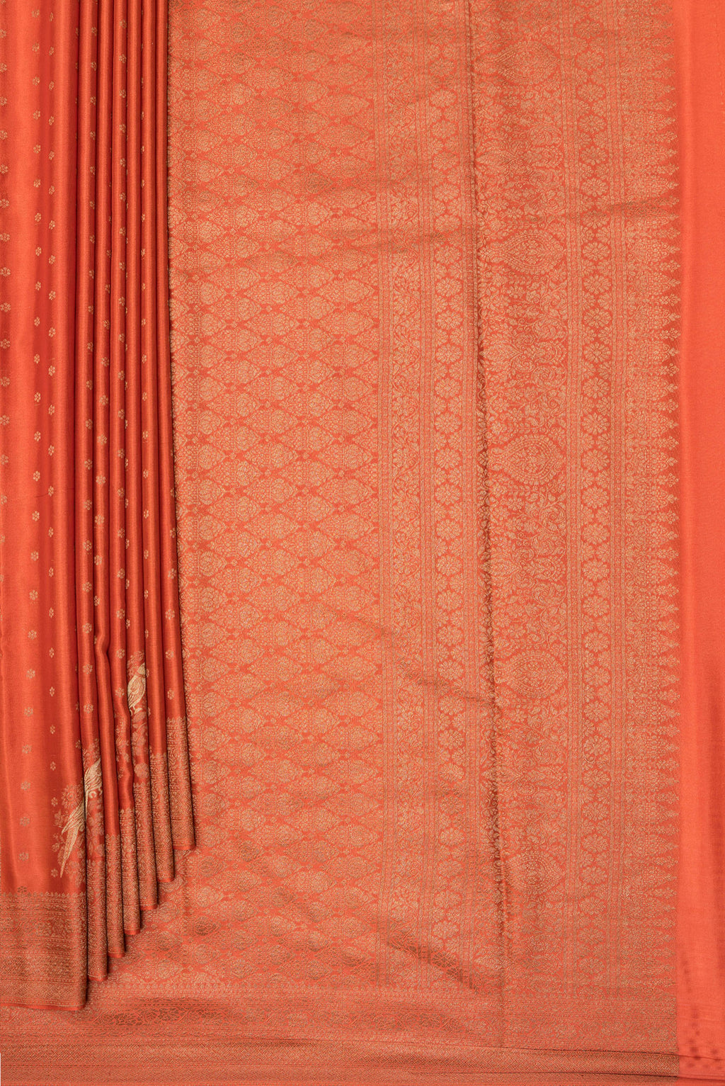 Pleats and pallu of Rust Dual Tone Banarasi Georgette Saree with Zari Butta on the body and Zari Border. 