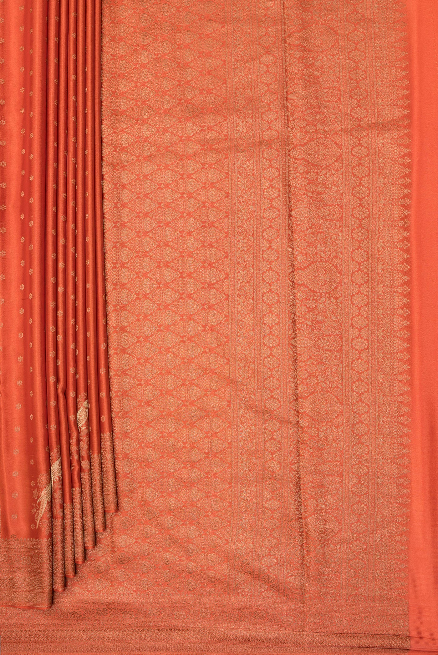 Pleats and pallu of Rust Dual Tone Banarasi Georgette Saree with Zari Butta on the body and Zari Border. 