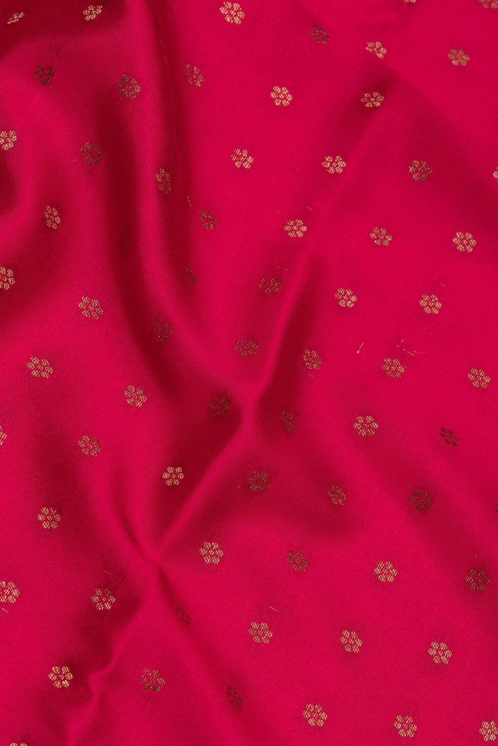 Close up of Dark Pink Dual Tone Banarasi Georgette Saree with Zari Butta on the body and Zari Border.  displaying folds