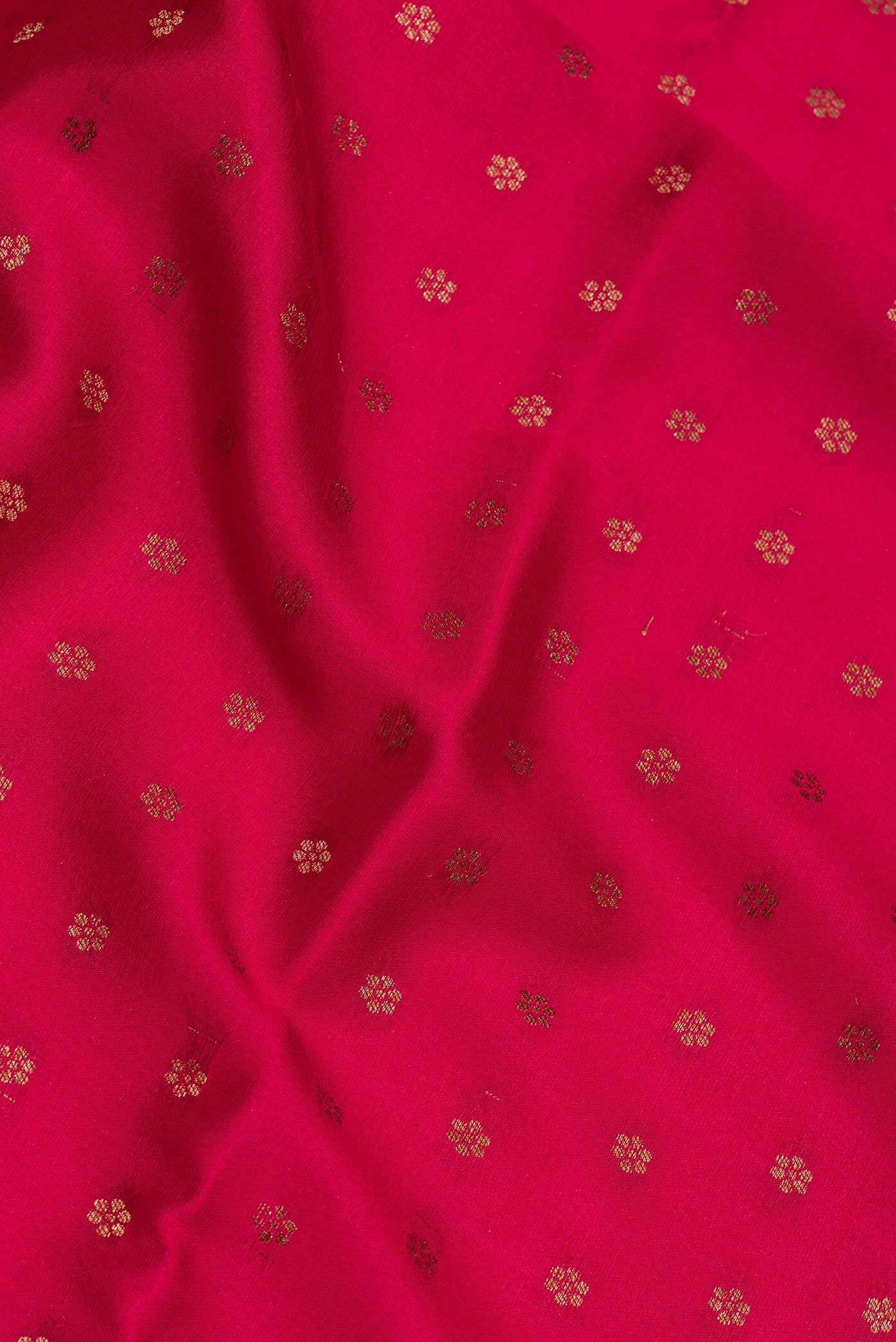Close up of Dark Pink Dual Tone Banarasi Georgette Saree with Zari Butta on the body and Zari Border.  displaying folds
