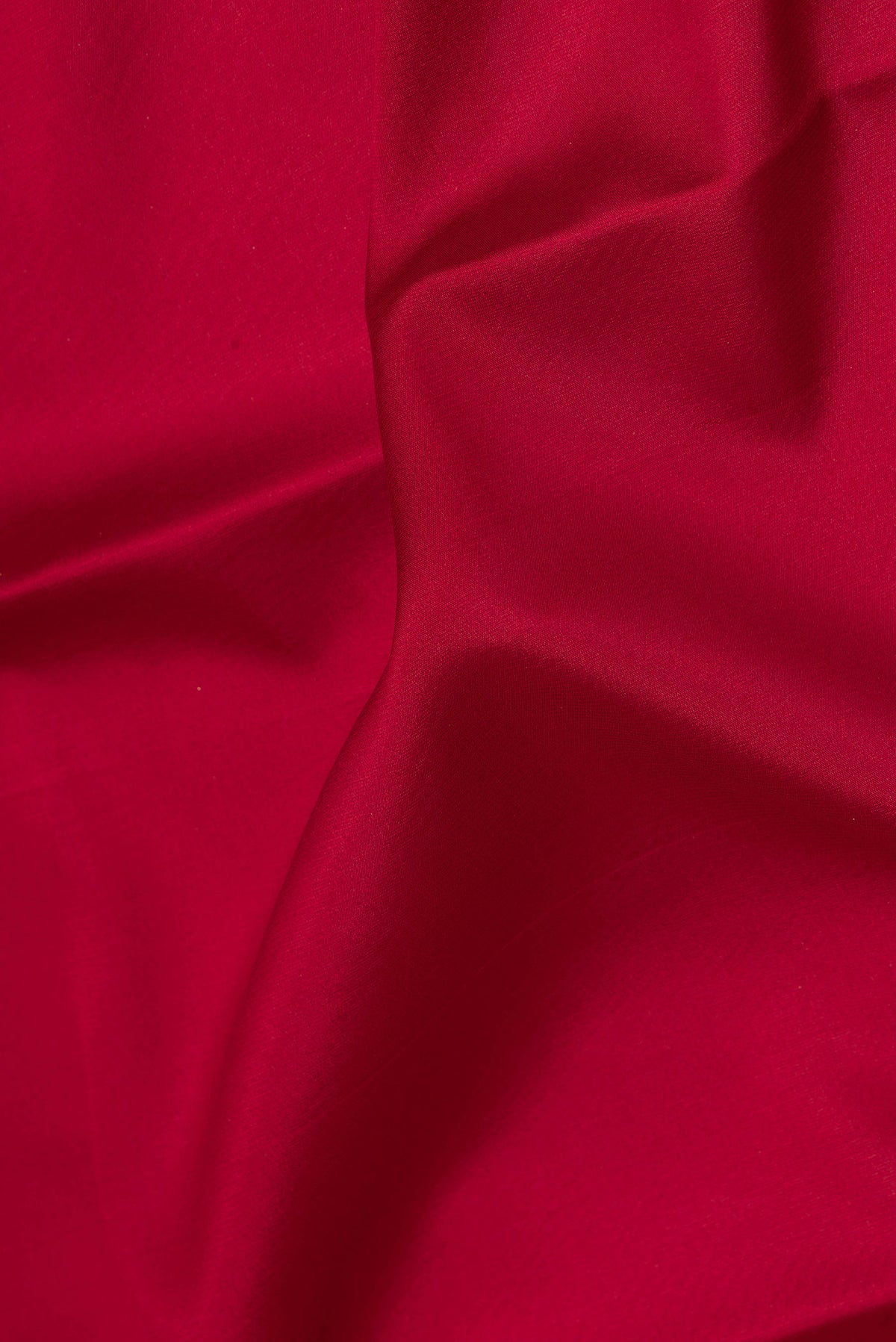 Close up of Pure Silk Maroon Dual Tone Banarasi Georgette Saree with Plain Body and Zari Border.  displaying folds