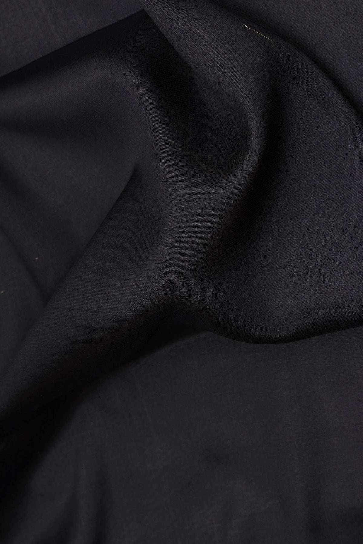 Close up of Pure Silk Coffee Brown Dual Tone Banarasi Georgette Saree with Plain Body and Zari Border.  displaying folds