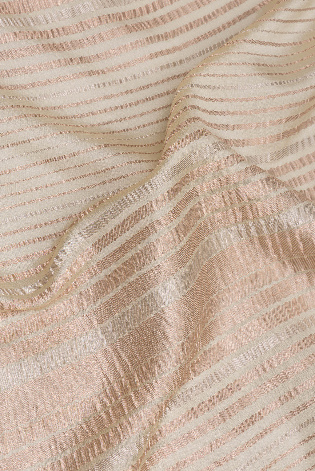 Close up of Beige Georgette Saree with Stripes on the body and Without Border.  displaying folds