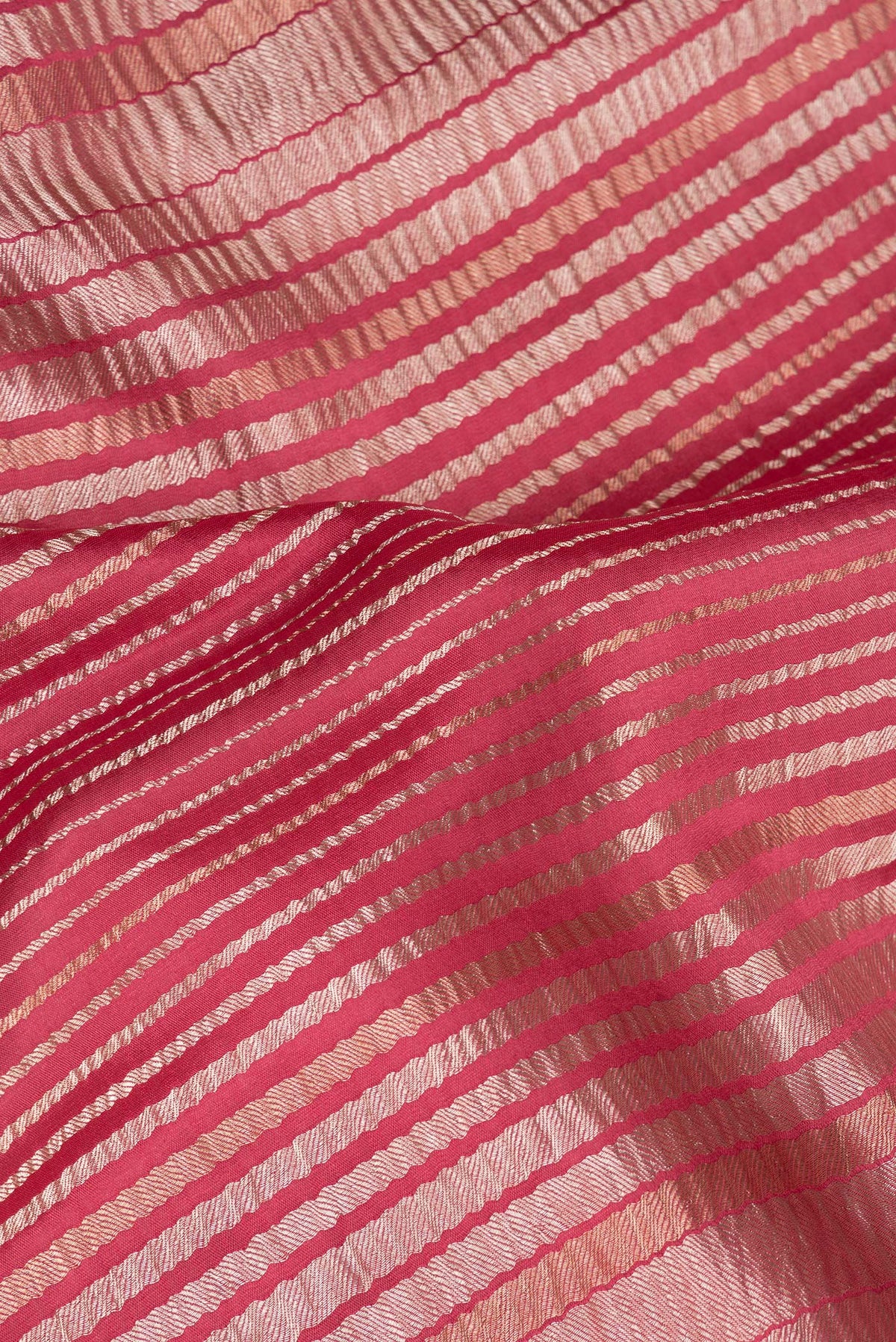 Close up of Imperial Red Banarasi Tussar Georgette Saree with Stripes on the body and Without Border.  displaying folds