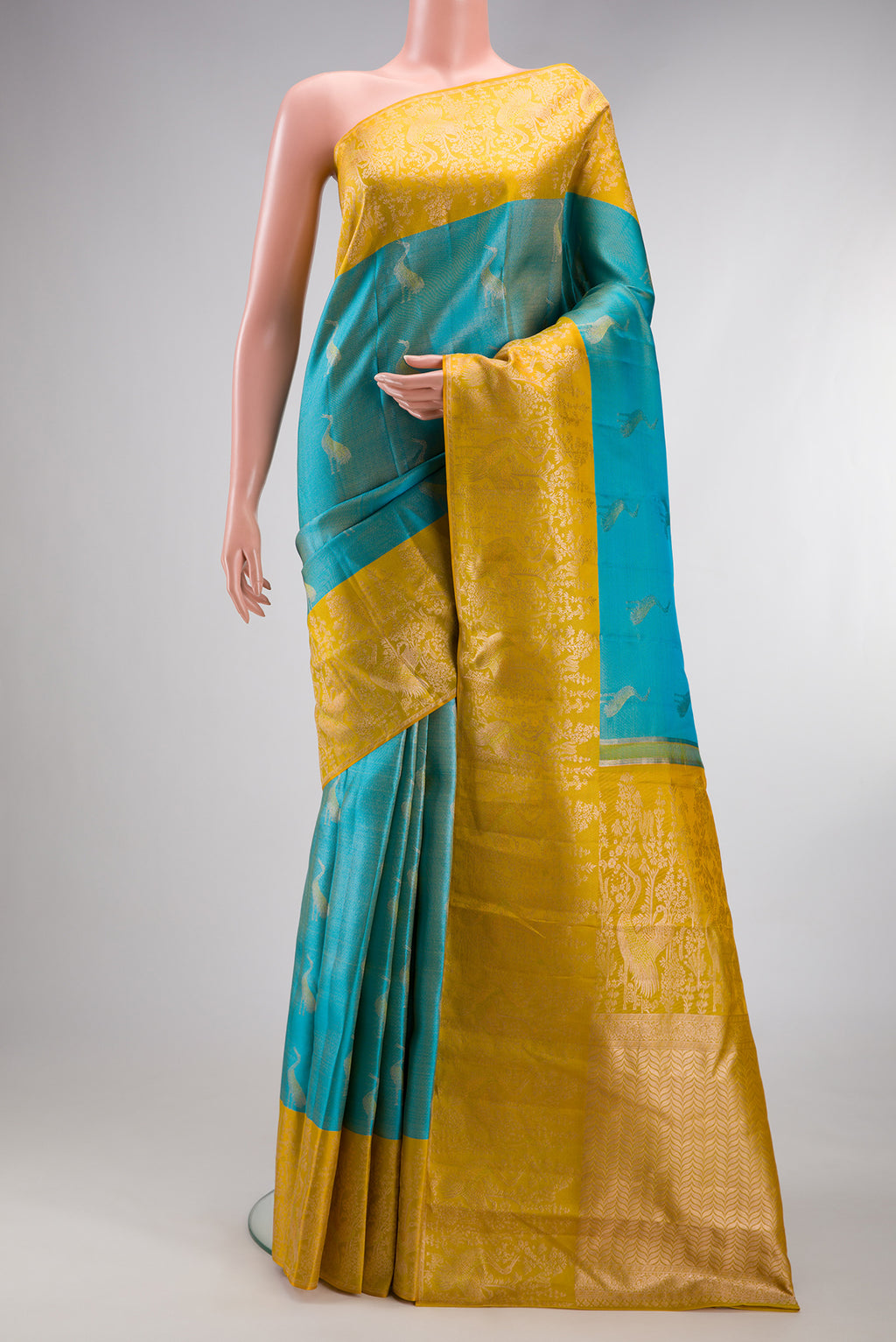 Sky Blue Kanchipuram Tissue Silk Saree with Zari Brocade on the body and Fancy Border.  displayed on a mannequin