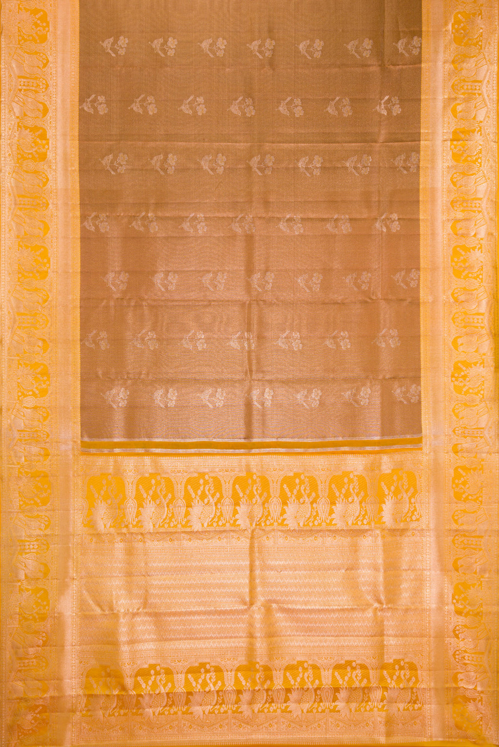 Flat view of Brown Dual Tone Kanchipuram Tissue Silk Saree with Zari Butta on the body and Fancy Border. 
