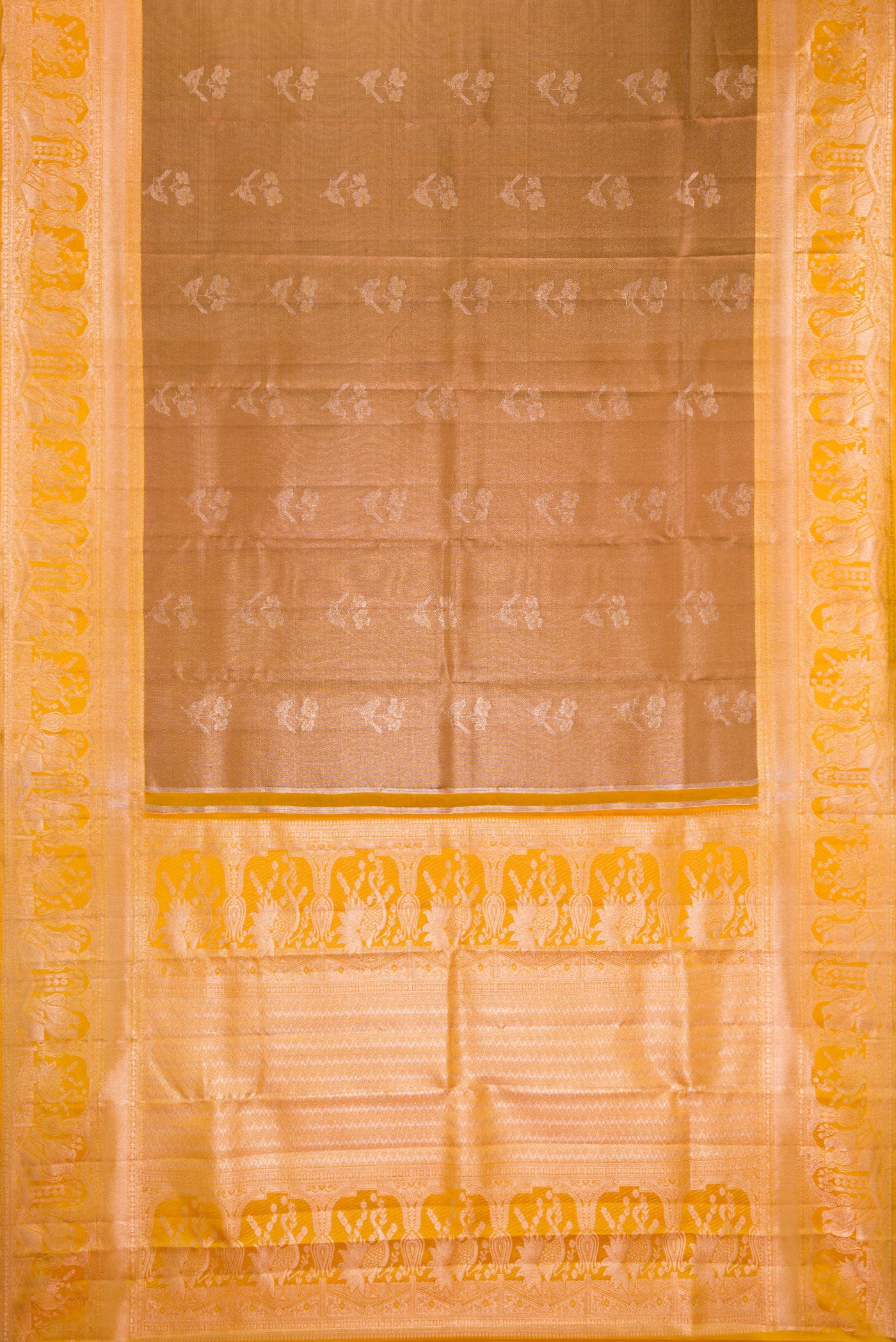 Flat view of Brown Dual Tone Kanchipuram Tissue Silk Saree with Zari Butta on the body and Fancy Border. 