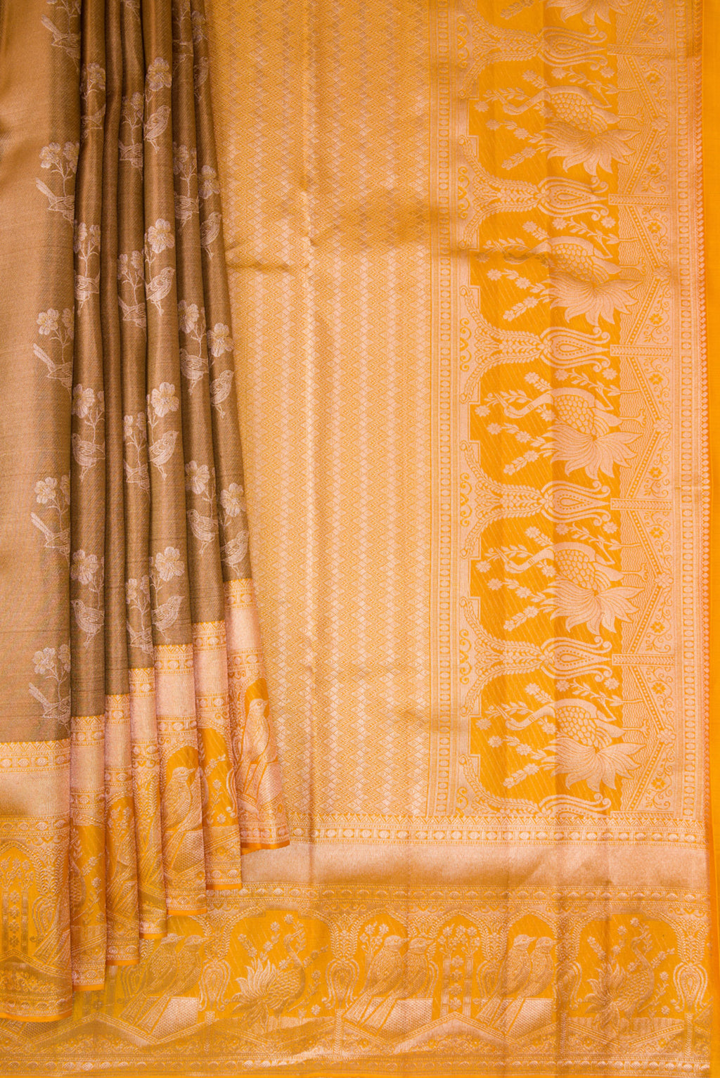 Pleats and pallu of Brown Dual Tone Kanchipuram Tissue Silk Saree with Zari Butta on the body and Fancy Border. 