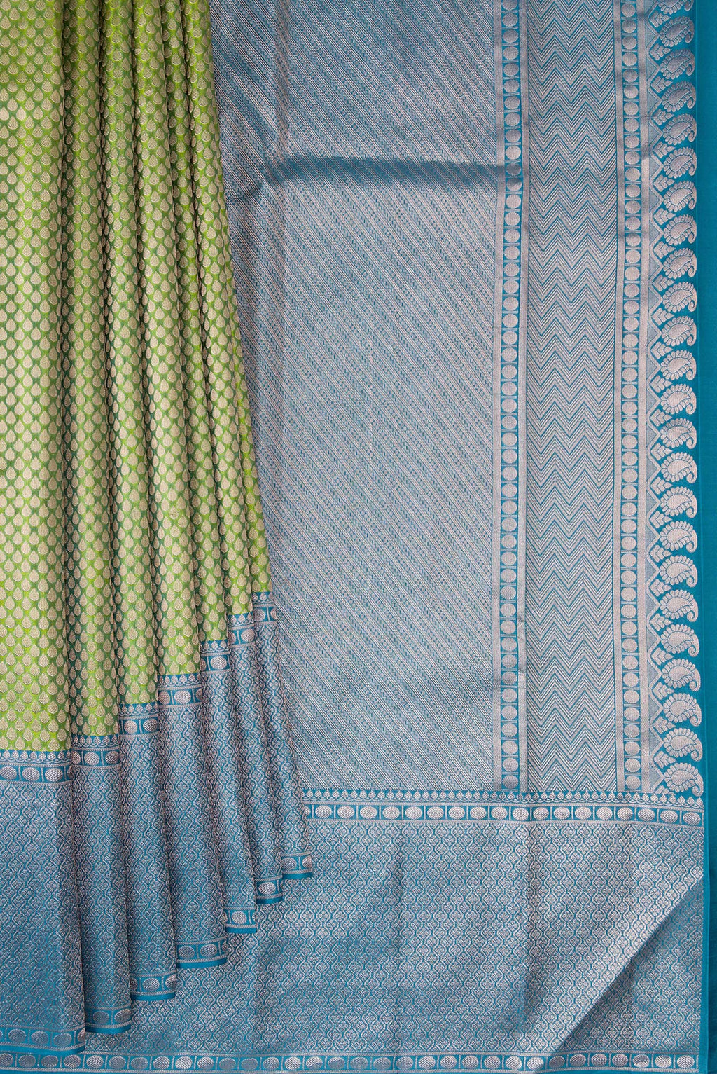 Pleats and pallu of Green Kanchipuram Tissue Silk Saree with Zari Brocade on the body and Zari Border. 
