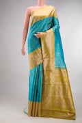 Sky Blue Dual Tone Kanchipuram Tissue Silk Saree with Checked design on the body and Fancy Border.  displayed on a mannequin