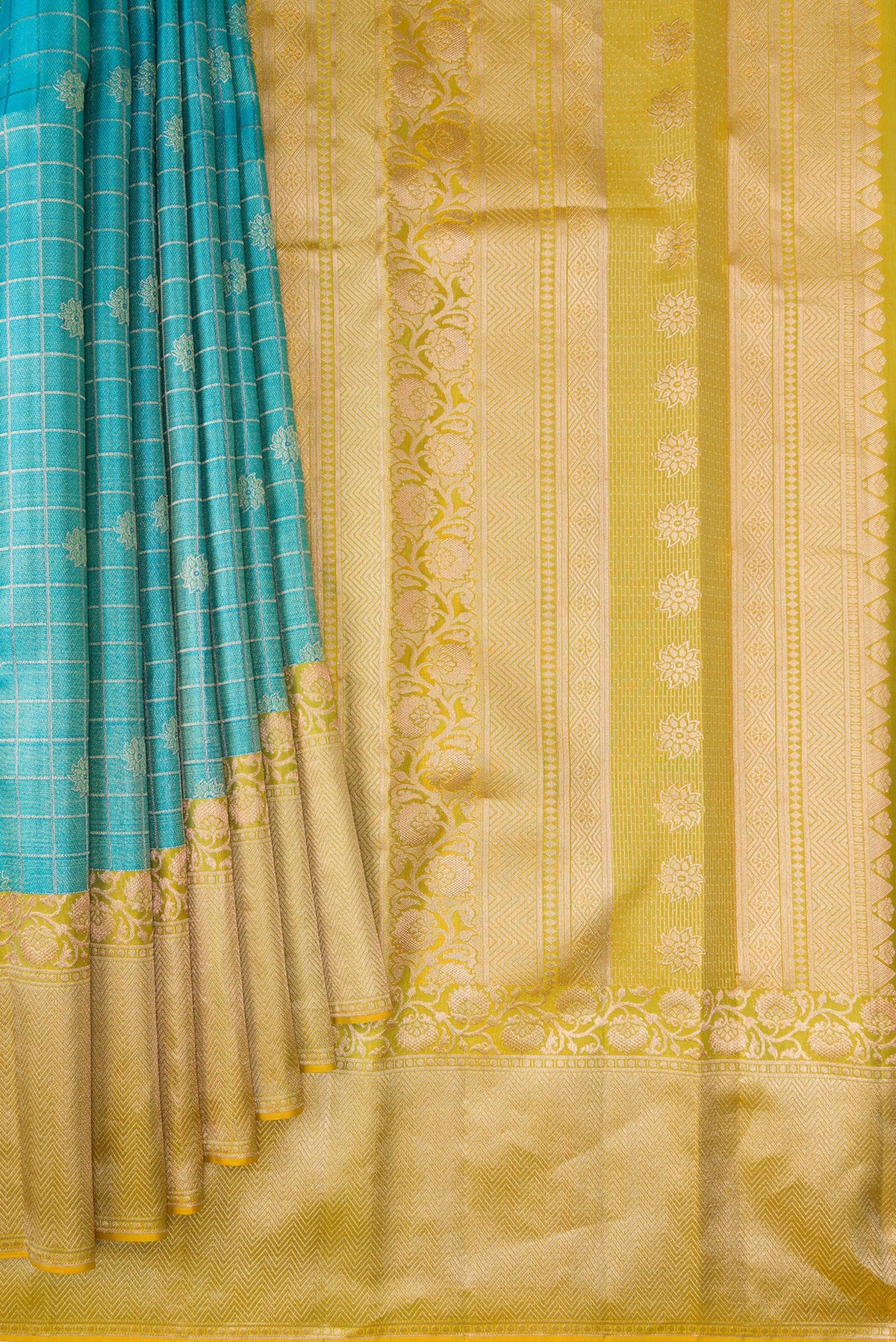 Pleats and pallu of Sky Blue Dual Tone Kanchipuram Tissue Silk Saree with Checked design on the body and Fancy Border. 