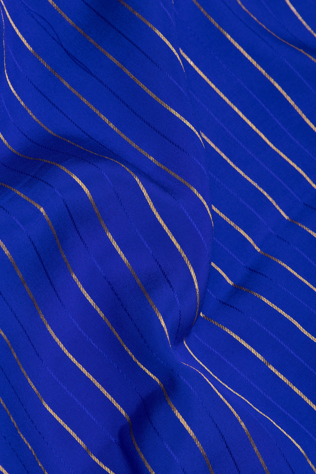 Close up of Royal Blue Mysore Silk Saree with Stripes on the body and Embroidery Border.  displaying folds