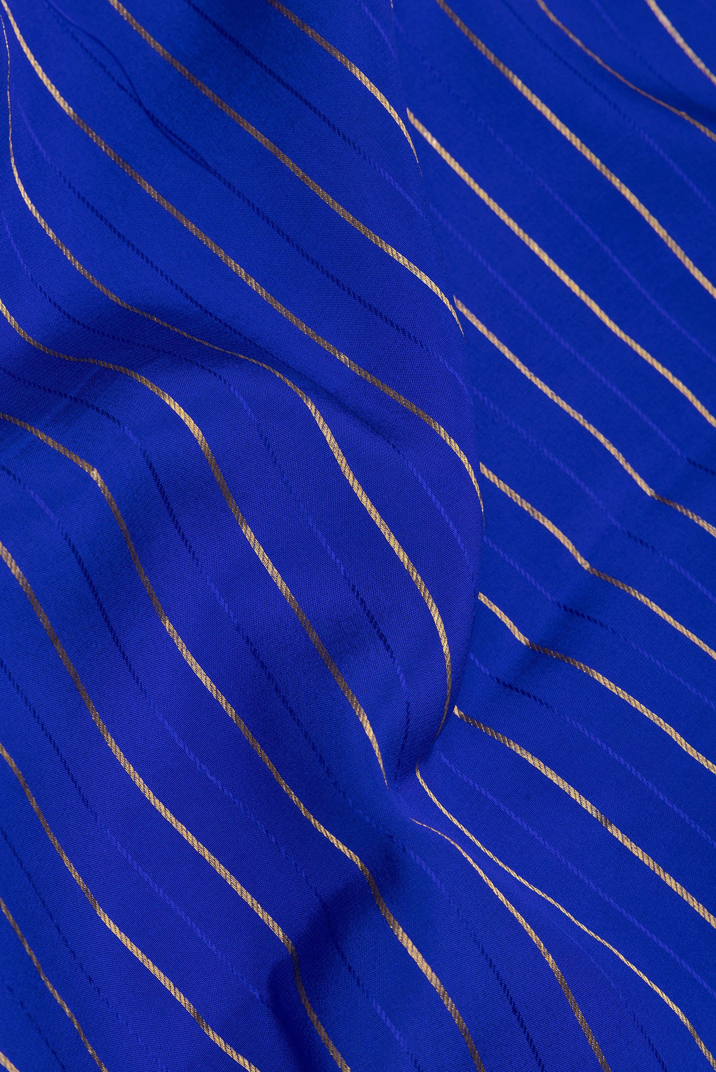 Close up of Royal Blue Mysore Silk Saree with Stripes on the body and Embroidery Border.  displaying folds