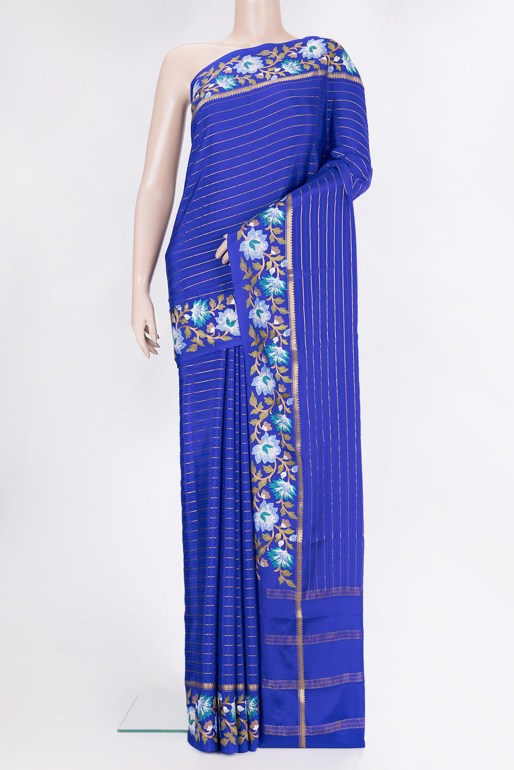 Royal Blue Mysore Silk Saree with Stripes on the body and Embroidery Border.  displayed on a mannequin