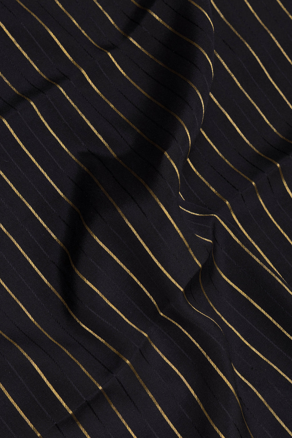 Close up of Black Mysore Silk Saree with Stripes on the body and Fancy Border.  displaying folds