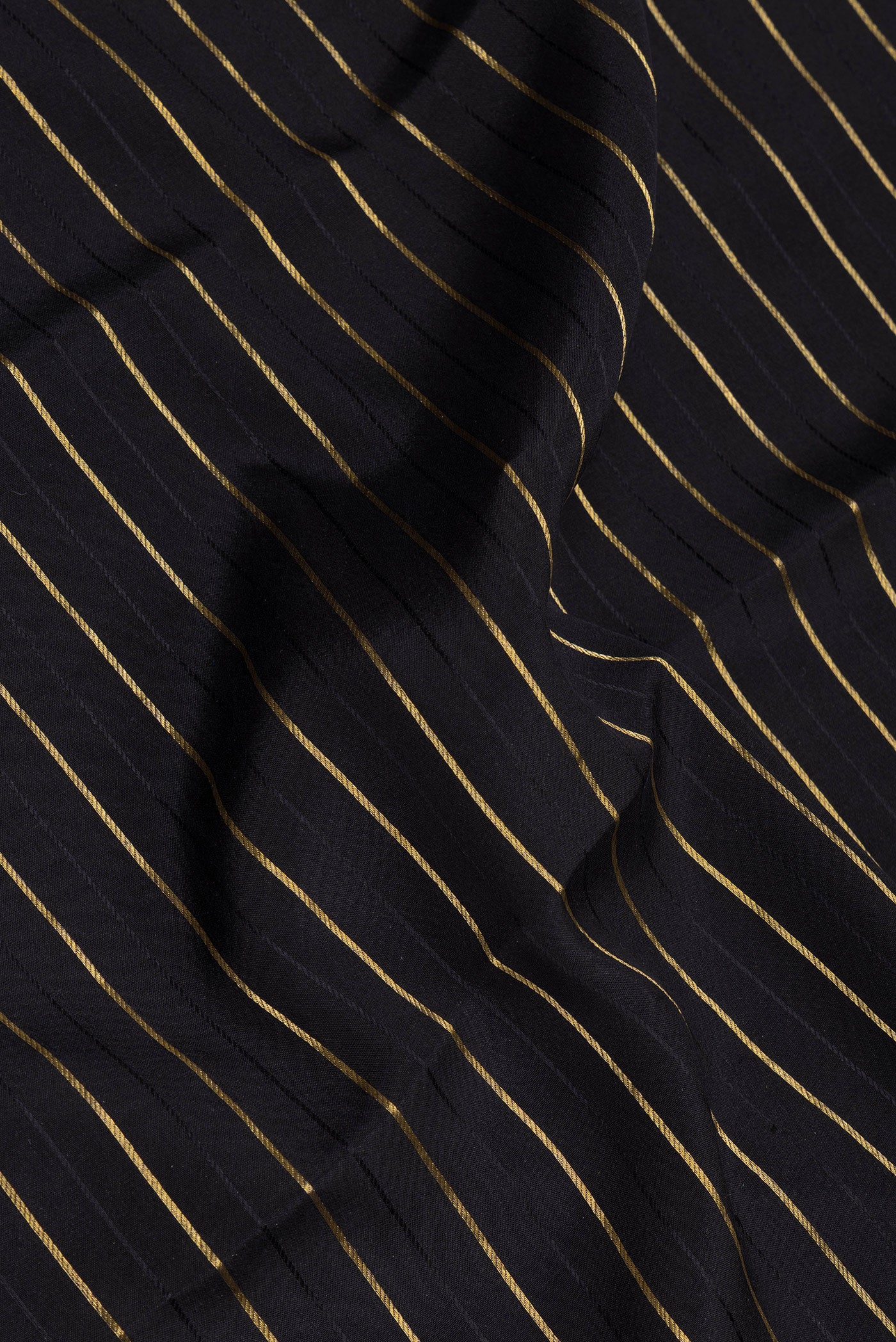 Close up of Black Mysore Silk Saree with Stripes on the body and Fancy Border.  displaying folds