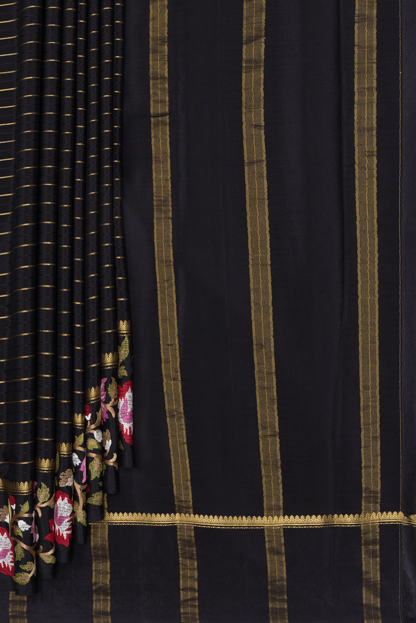 Pleats and pallu of Black Mysore Silk Saree with Stripes on the body and Fancy Border. 