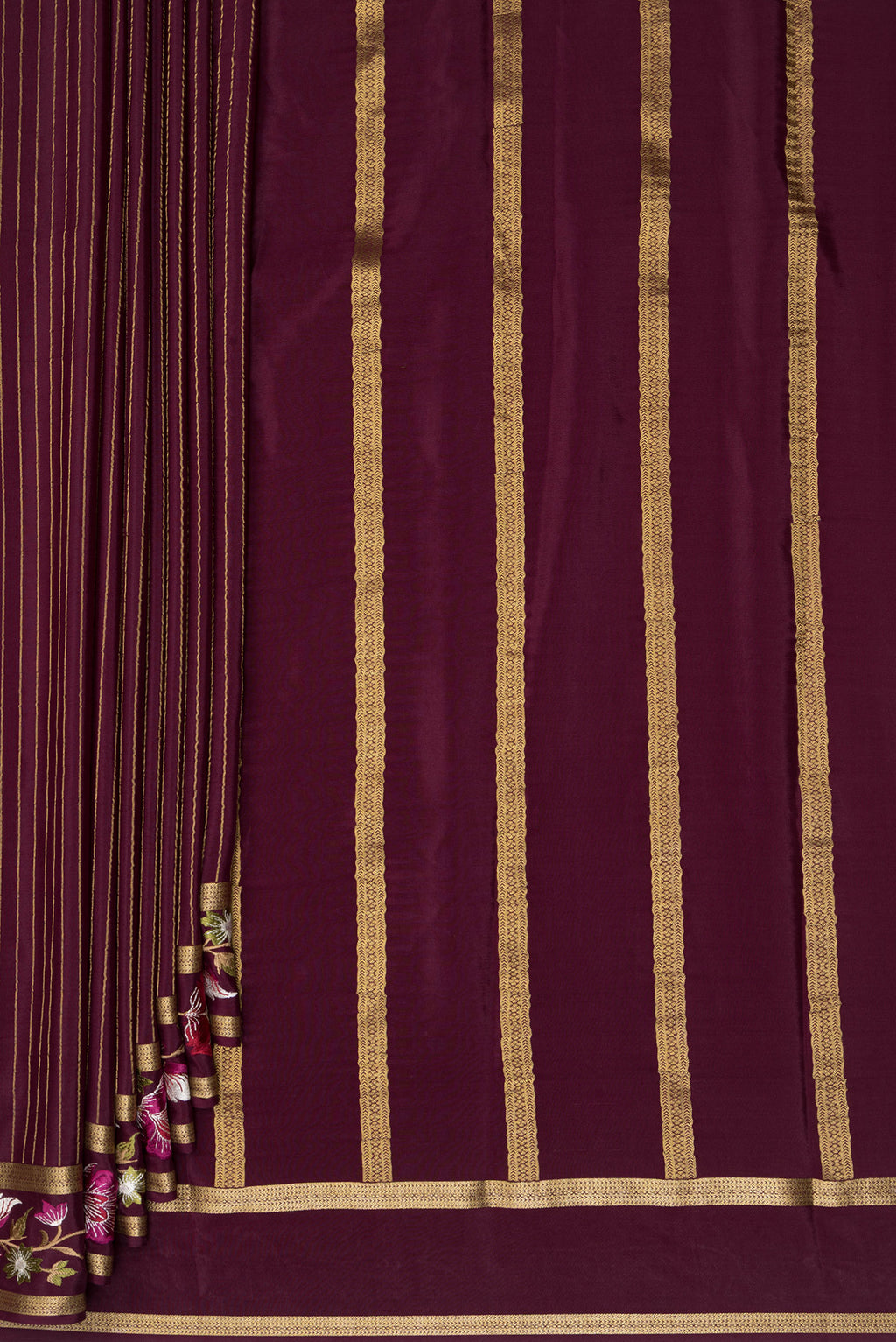 Pleats and pallu of Coffee Brown Mysore Crepe Saree with Stripes on the body and Embroidered Border. 