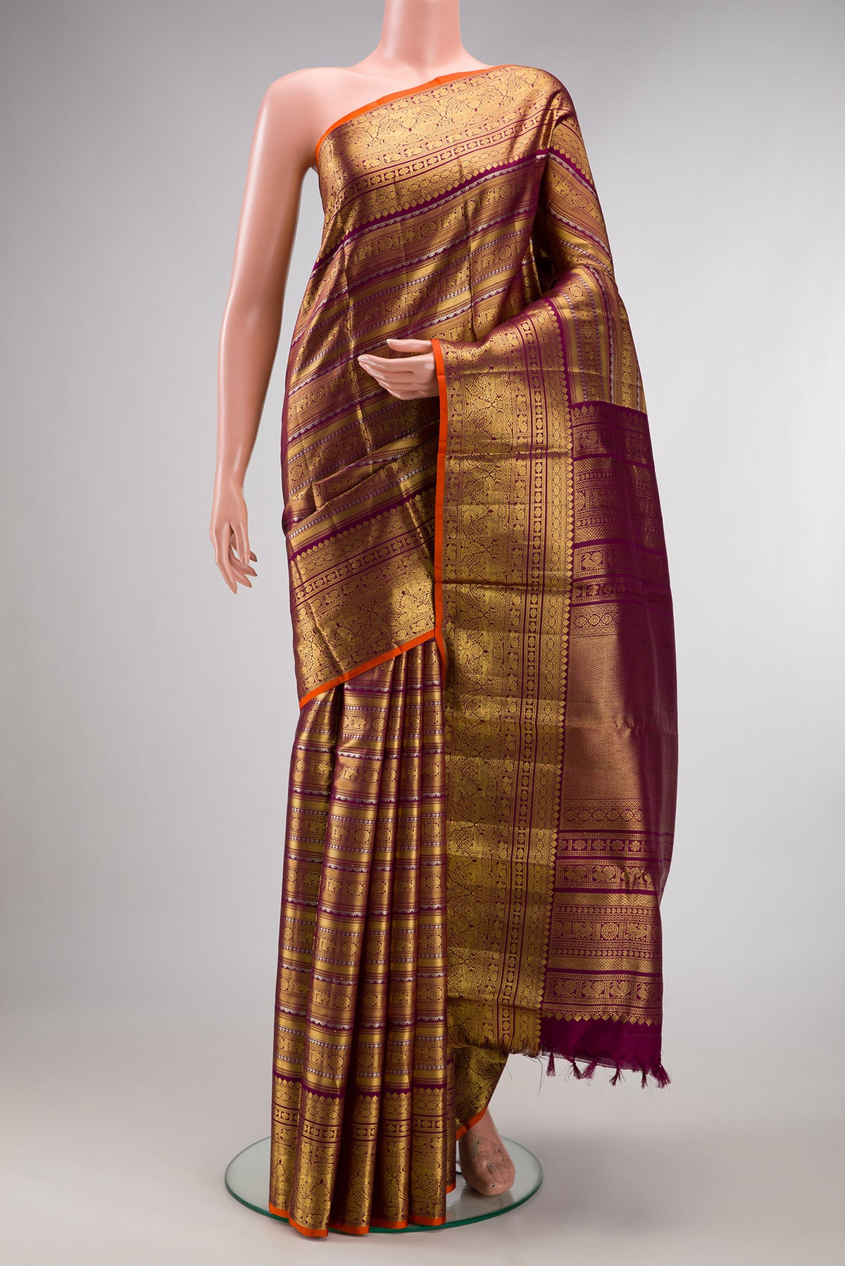 Pure Silk Purple Kanchipuram Saree with Zari Brocade on the body and Fancy Border.  displayed on a mannequin