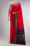 Pure Silk Red Kanjivaram Saree with Checked design on the body and Zari Border.  displayed on a mannequin