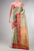 Pista Green Dual Tone Kanjivaram Tissue Saree with Zari Brocade on the body and Zari Border.  displayed on a mannequin