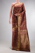 Maroon Kanjivaram Silk Saree with Zari Brocade on the body and Zari Border.  displayed on a mannequin