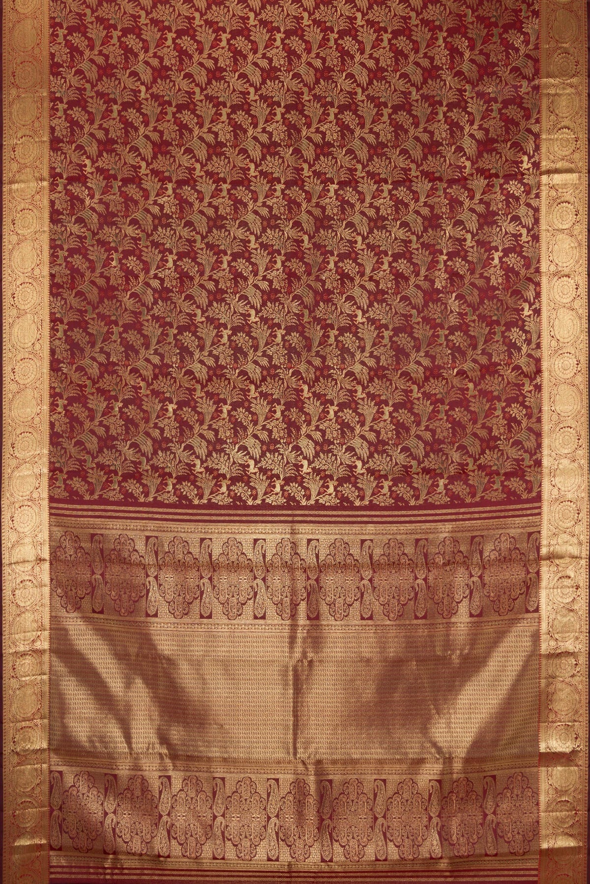 Flat view of Maroon Kanjivaram Silk Saree with Zari Brocade on the body and Zari Border. 