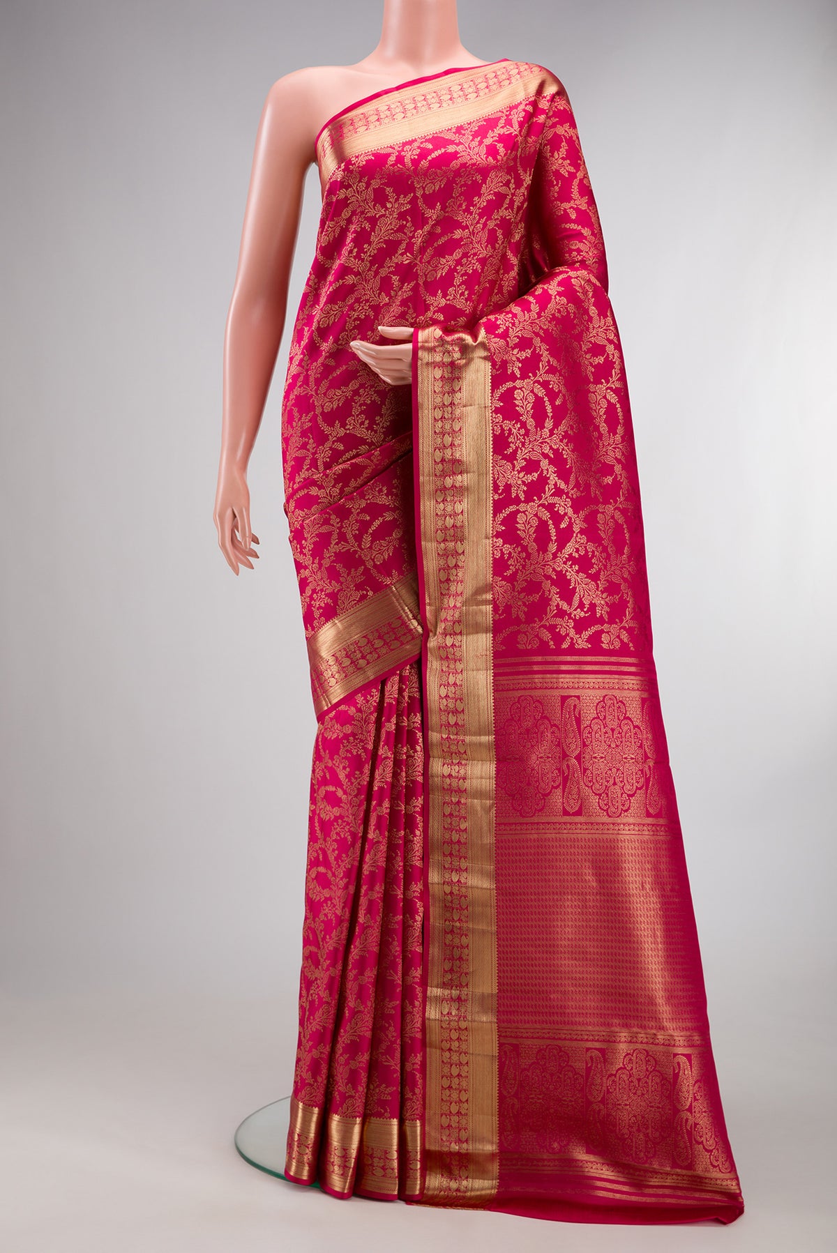 Pure Silk Dark Pink Dual Tone Kanjivaram Saree with Zari Brocade on the body and Zari Border.  displayed on a mannequin