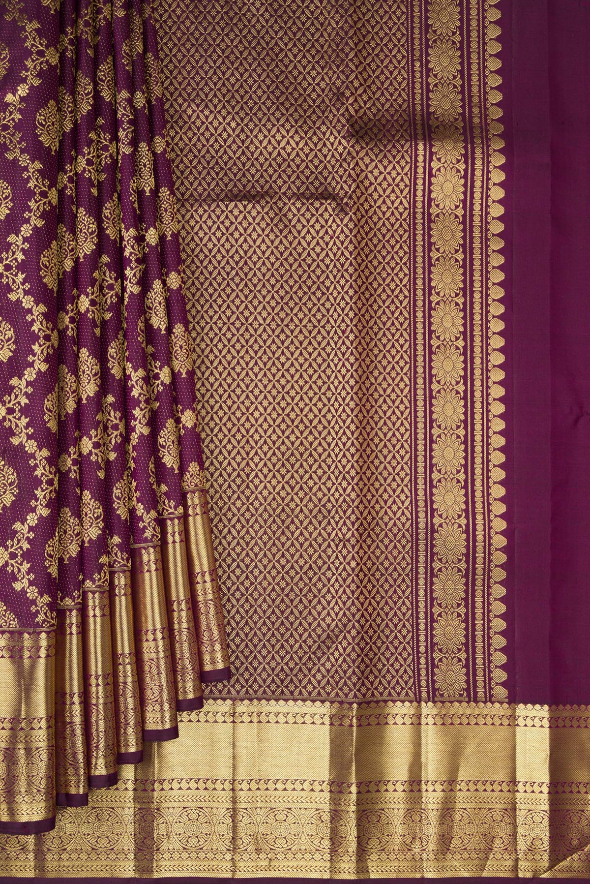 Pleats and pallu of Burgundy Kanjivaram Silk Saree with Zari Brocade on the body and Zari Border. 