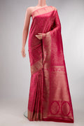 Dark Pink Kanjivaram Silk Saree with Zari Brocade on the body and Paithani Border.  displayed on a mannequin