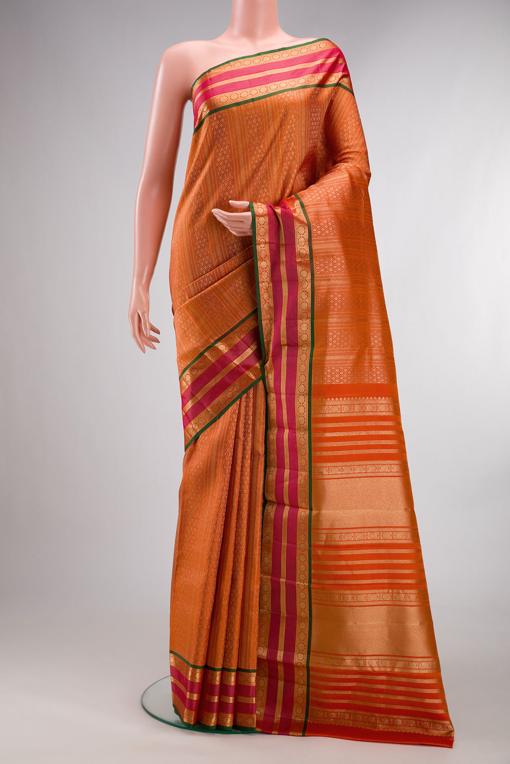 Pure Silk Mustard Dual Tone Kanjivaram Saree with Zari Brocade on the body and Zari Border.  displayed on a mannequin